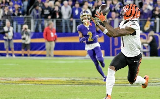 Jamarr Chase makes a catch well ahead of any other player and sprints with the football