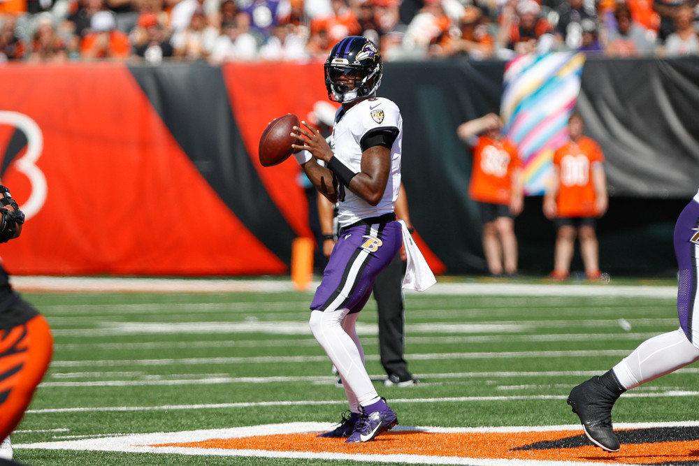 Lamar Jackson prepares to throw a pass.