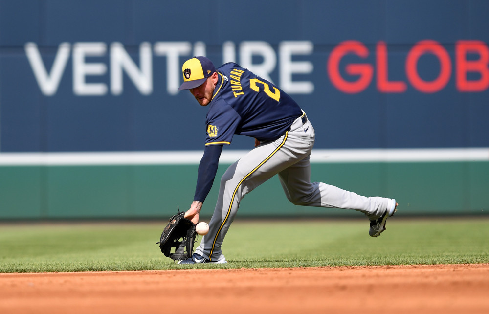 Brice Turang makes a backhand play at second base