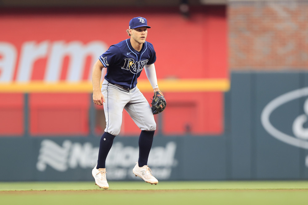 Taylor Walls stands in a ready position at shortstop, waiting for a ball to be hit to him.