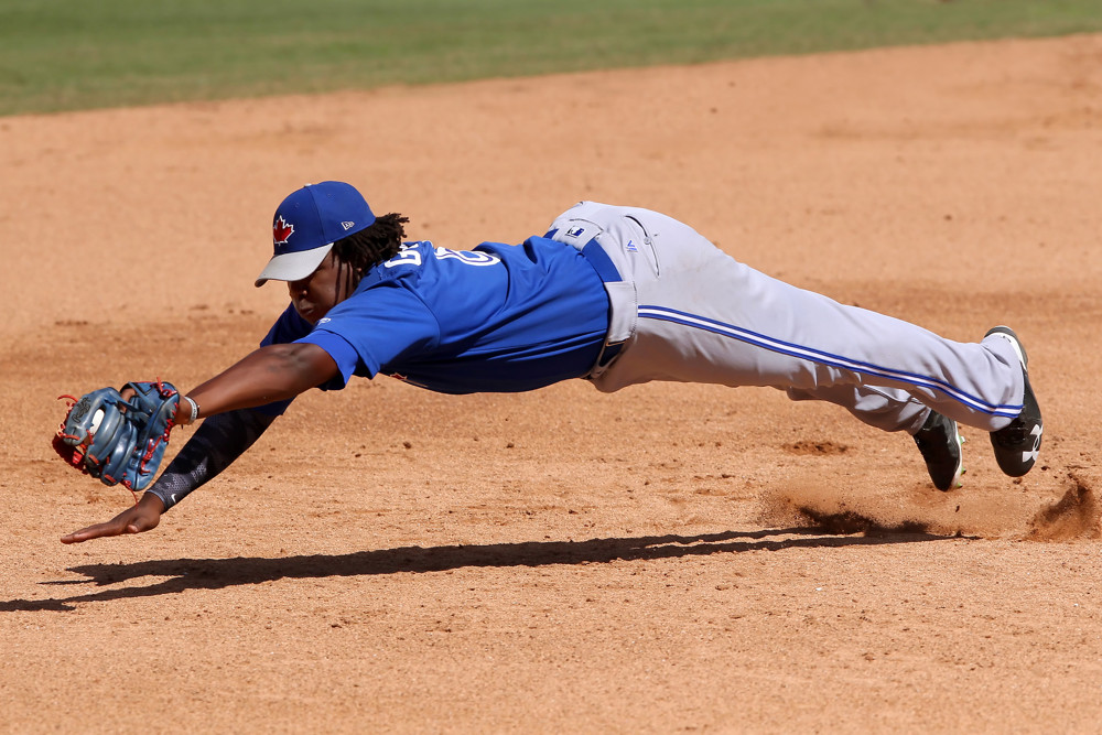 In 2016, Vladimir Guerrero Jr. dives to make a backhand play on a ground ball.
